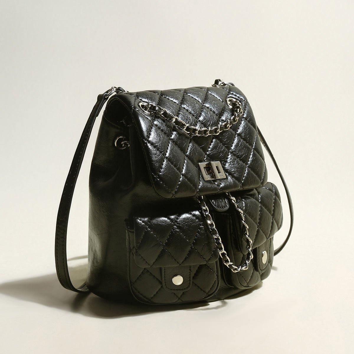 Multi-Pocket Chainstrap Quilted Backpack – Diamond-Quilted Leather Backpack with Silver Chain Straps & Turn-Lock Closure
