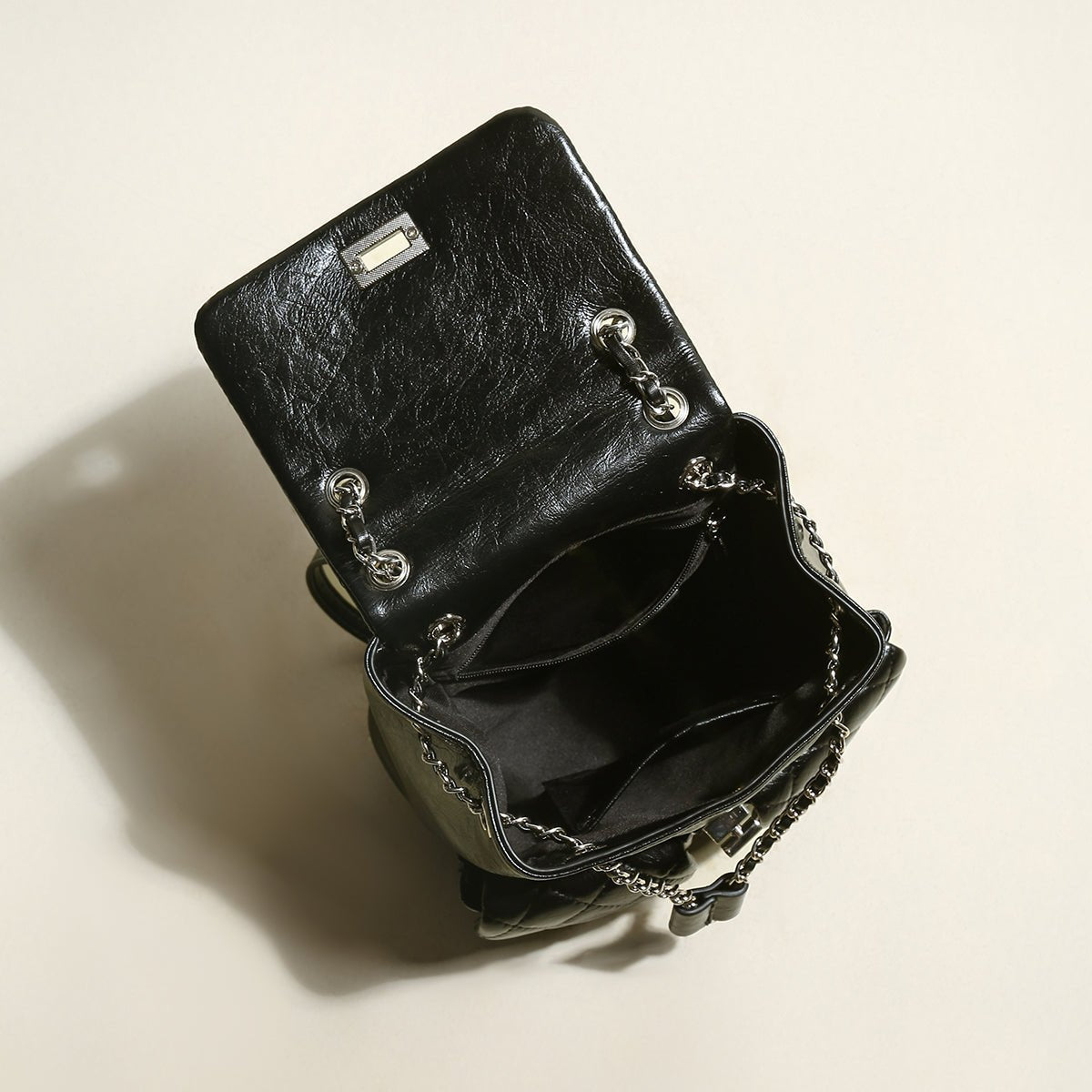 Multi-Pocket Chainstrap Quilted Backpack – Diamond-Quilted Leather Backpack with Silver Chain Straps & Turn-Lock Closure